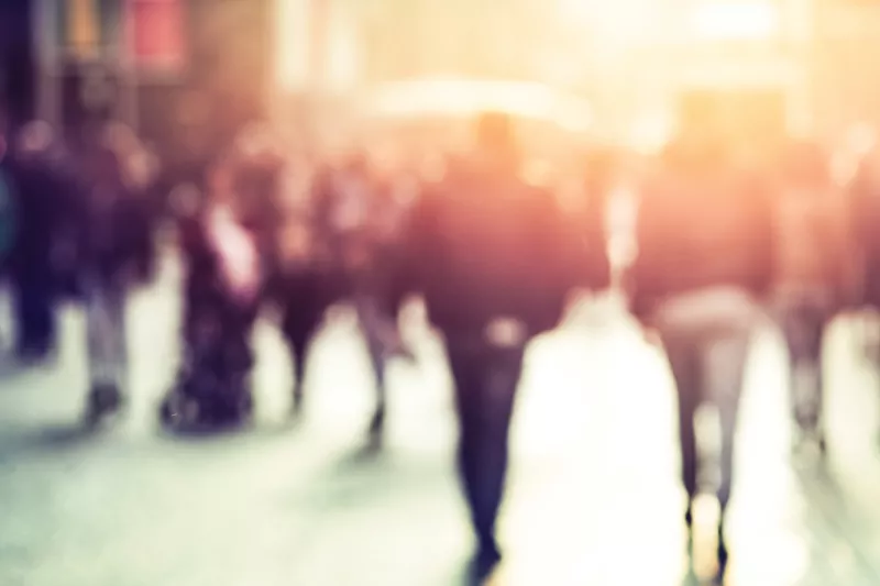 crowded area of people in blurred light