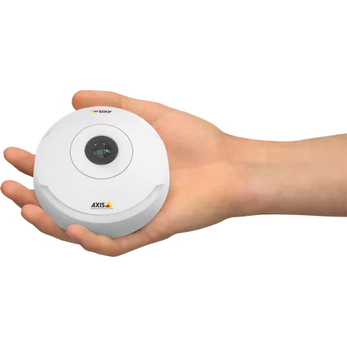 Human hand holding round AXIS camera.