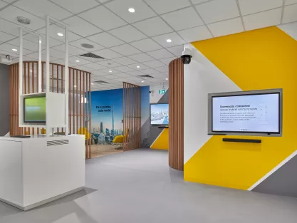 Overview of an Axis experience center in Dubai. Three screens showing Axis' product information.